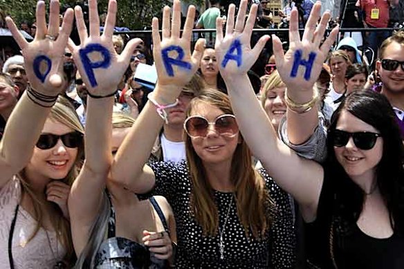 Oprah Winfrey fans wait at Federation Square for the show to start.