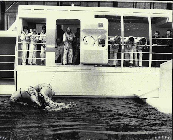 Qantas cabin crew during emergency evacuation exercises from a simulated Boeing 747 at the Qantas Flight Training centre, August 26, 1971. 