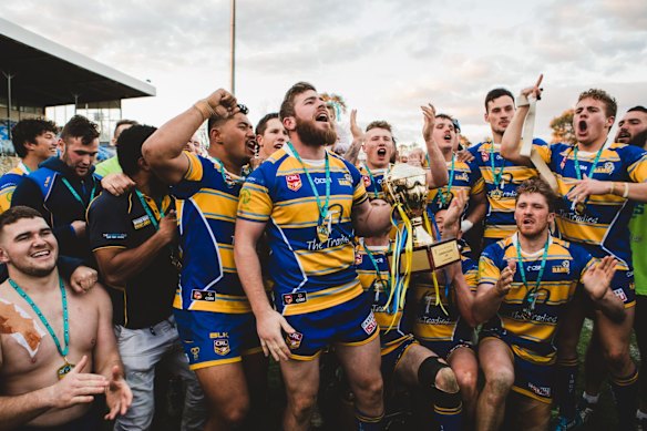 Woden Valley Rams captain Jeffrey Morgan celebrates their win.

