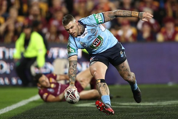 Josh Dugan of the Blues scores a try.