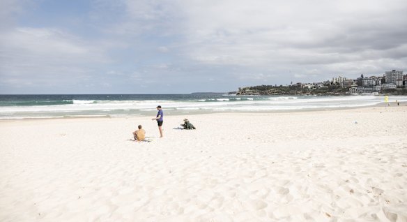 The last few people on Bondi beach on Saturday afternoon.