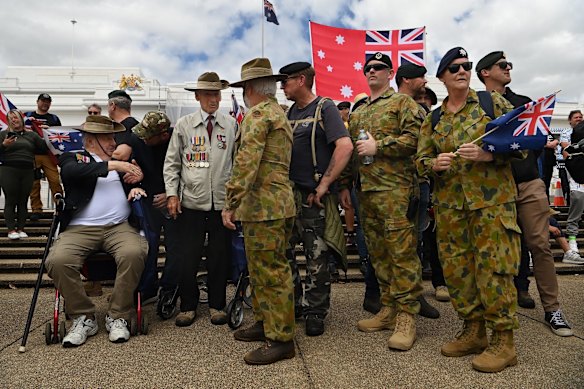 Ex-servicemen Neil Renfree (left) from NSW and John Murphy (third left) from Victoria at the Convoy to Canberra rally.