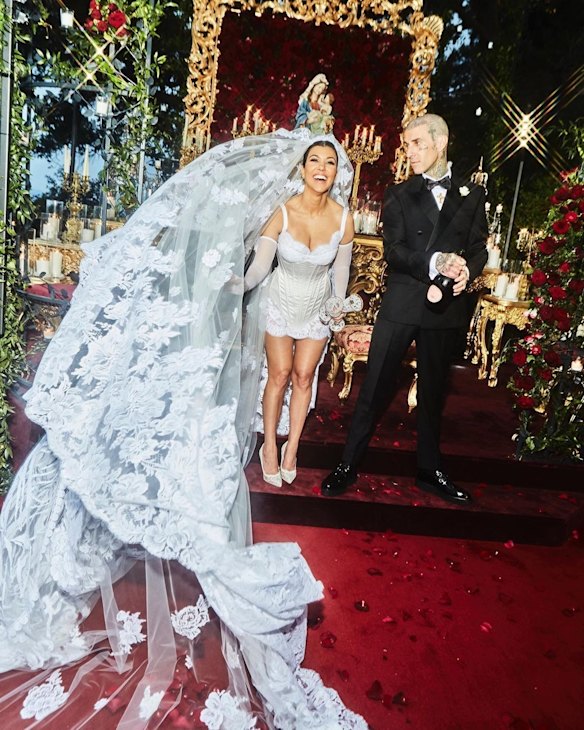 Kourtney Kardashian and Travis Barker both wore Dolce & Gabbana for the ceremony.