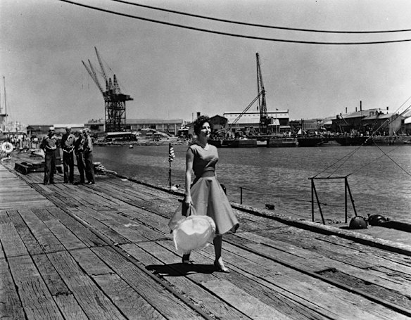 Actress Ava Gardner as Moira Davidson walks along a wharf in the Port of Melbourne in 1959. 