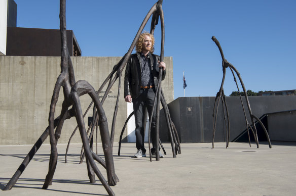 Danie Mellor with his new sculpture at the Museum of Contemporary Art.