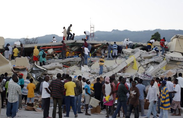 Resident search for survivors among the debris.