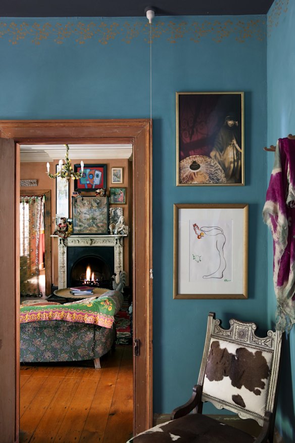 The view from the bedroom into the sitting room. The wall at front is in Porter’s Easter Turquoise shade. The Indian cowhide chair is from Rosie’s shop.