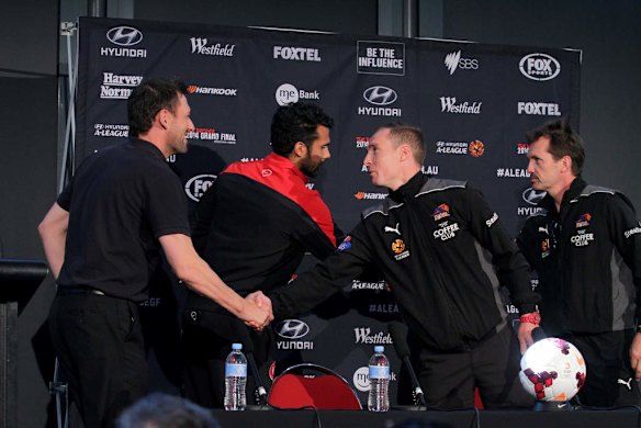 Western Sydney Wanderers coach Tony Popovic and player Nikolai Topor-Stanley with Brisbane Roar captain Matt Smith and coach Mike Mulvey at a media conference at Suncorp Stadium, Brisbane ahead of the A-League 2014 Grand Final.