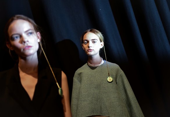 Models await their turn backstage.