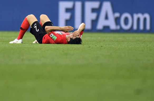 South Korea's Lee Yong reacts at the end of the match.