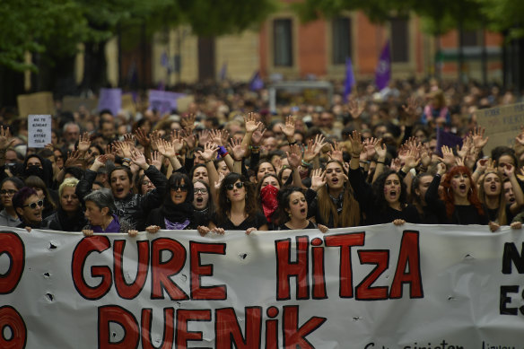 Women hold up a sign reading in basque language, ''Our Word''.
