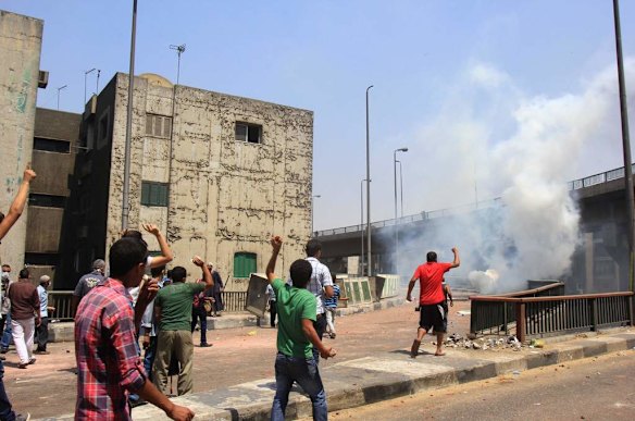 Supporters of Egypt's ousted President Mohammed Morsi clash with security forces near the largest sit-in by supporters of ousted Islamist President Mohammed Morsi in the eastern Nasr City district of Cairo, Egypt.