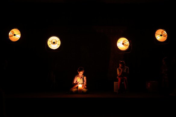 A cast member lights a candle during a performance of "Mama Po Skaipu" (Mother via Skype) in an air raid shelter in Lviv. The play told stories on the difficulties of families being separated from the mother from the child's point of view. Performed in a designated air raid shelter, the performance provided a rare chance for a cultural experience in a city under regular air raid alert conditions.