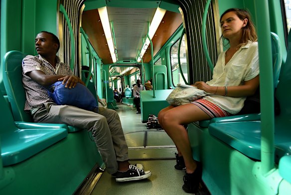 Mohamed Ahmed (left) 23 from Darfur in Sudan rides the train in Milan while he waits for money to be wired from Sudan so that he can proceed to another country. Mohamed was one of the 415 people rescued by the Migrant Offshore Aid Station on board the MY Phoenix.