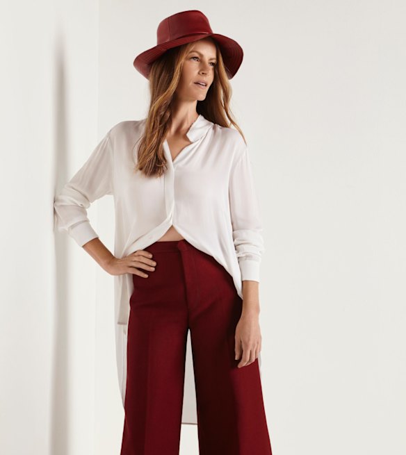  Elvie & Leo “Georgette” shirt, $250. Stella McCartney “Angela” cropped trousers, $965, from Parlour X. Hatmaker By Jonathan Howard “One Rainy Day” hat, $490