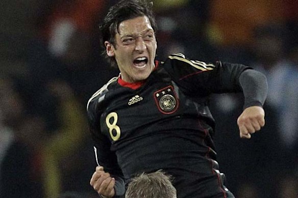 Mesut Ozil celebrates scoring the opening goal.