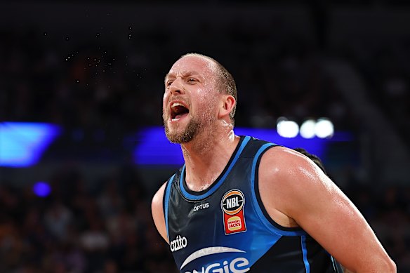 Ready to chirp: Melbourne United star Joe Ingles enjoys a chat on court with opponents. 
