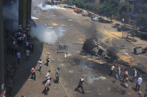 Supporters of Egypt's ousted President Mohammed Morsi clash with security forces near the largest sit-in by supporters of Morsi in the eastern Nasr City district of Cairo, Egypt.