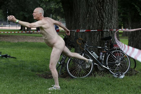 David Anderson performs some yoga stretches before the ride.