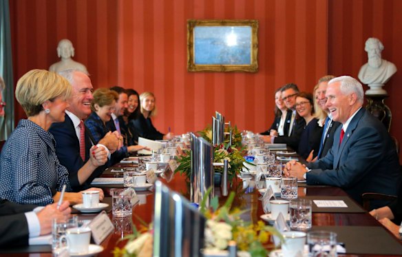 U.S. Vice President Mike Pence, right, and Australia's Prime Minister Malcolm Turnbull, second left, laugh during talks at Admiralty House in Sydney.