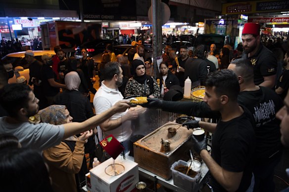 Muslims buy food at a stall in Haldon Street.