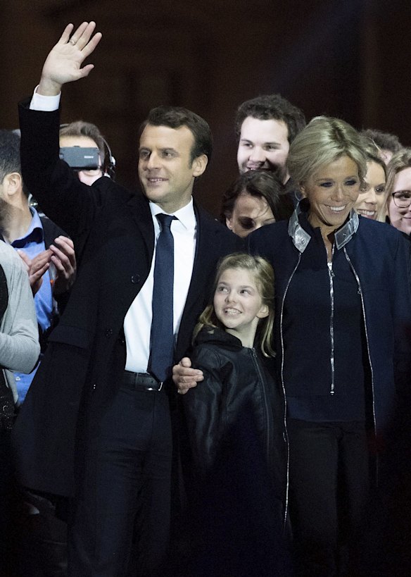 : Leader of 'En Marche !' Emmanuel Macron addresses supporters with wife Brigitte Trogneux (R) and her daughter Tiphaine Auziere (C) after winning the French Presidential Election, at The Louvre on May 7, 2017 in Paris, France. Pro-EU centrist Macron is the next president of France after defeating far right rival Marine Le Pen by a comfortable margin, estimates indicate. 