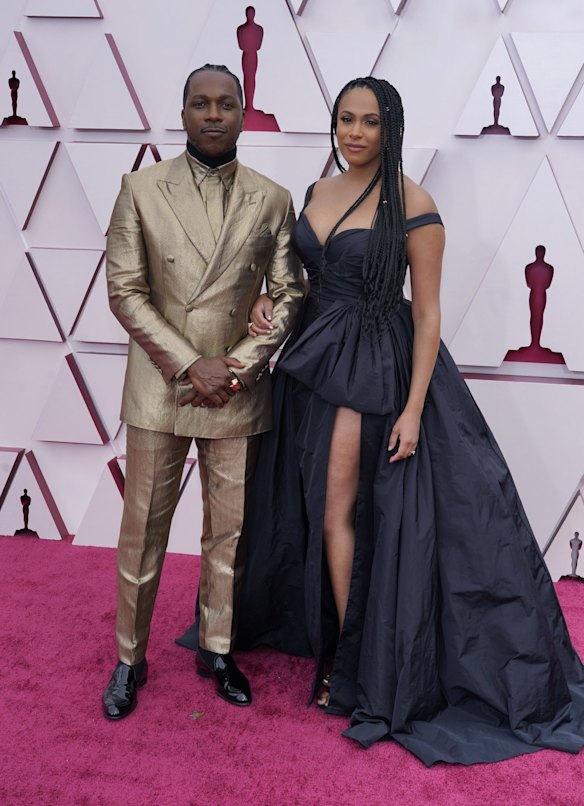 Leslie Odom Jr. in Brioni and Nicolette Robinson in Zuhair Murad arrive at the Oscars.