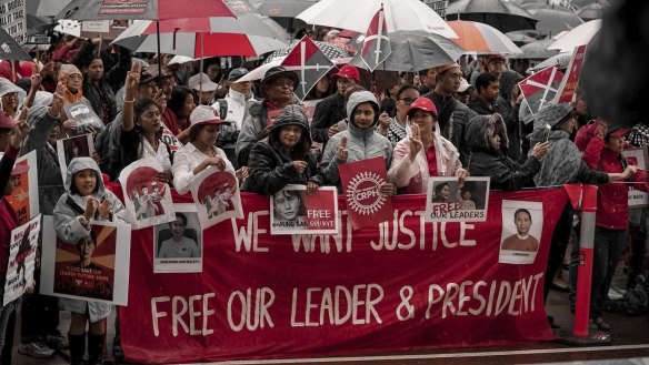 Hundreds protested the Myanmar miltary coup with placards urging the southeastern nation’s president be released. 