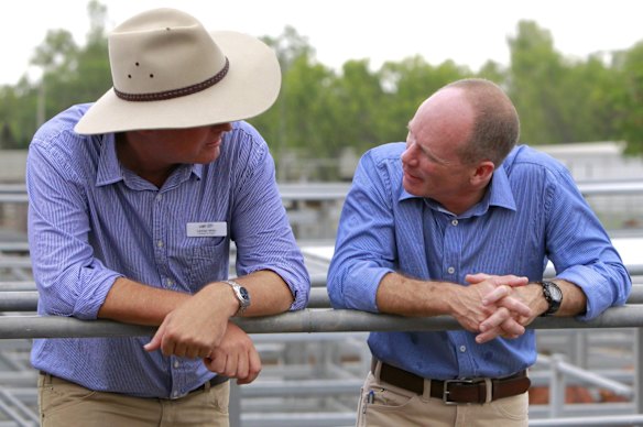 Premier Campbell Newman speaking with LNP colleague Lachlan Millar at the Emerald Sales Yard in Emerald. 