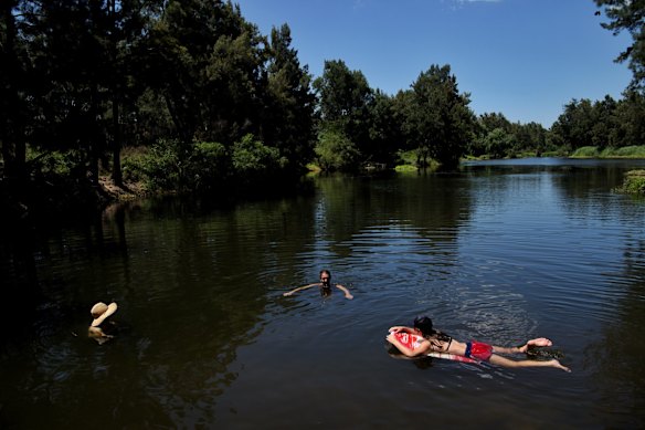 Locals swim in the Nepean River at Castlereagh as temperatures are forecasted to reach over 40 degrees in Sydney's west today.