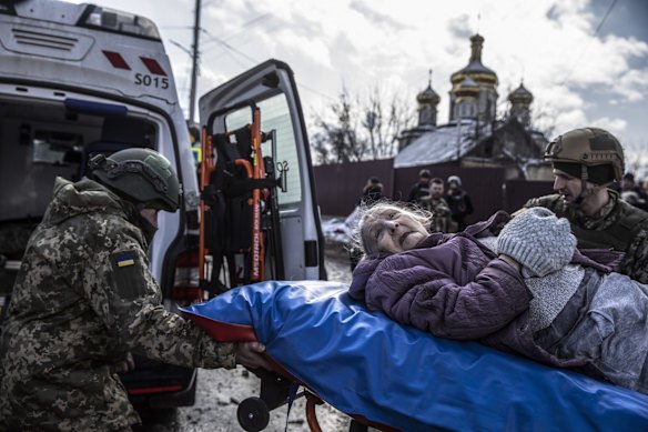 Members of Ukraine's Territorial Defense Force help to evacuate the elderly that fled to safety in Irpin, Ukraine.