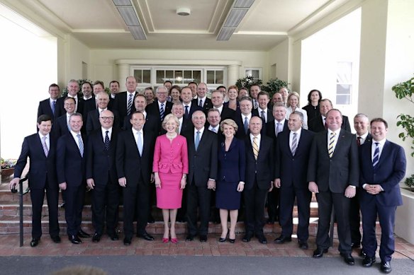 Governor-General Quentin Bryce poses for photos with Prime Minister Tony Abbott and his new ministry at Government House in Canberra.