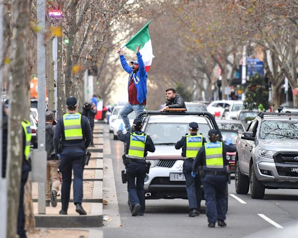 Italian soccer fans celebrate in Lygon Street, Carlton, after Italy won the Euro 2020 final against England at Wembley Stadium in London. 
