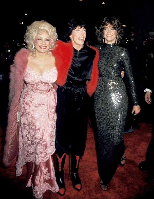 With Lily Tomlin and Jane Fonda at the 9 to 5 film premiere in 1980. She enlisted the movie’s costume designer Ann Roth for the occasion, and would later tell People magazine it was “the first time I ever really felt like I was fashionable.”