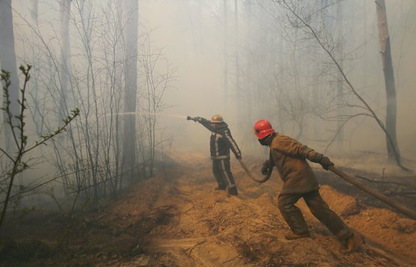 Ukrainian firemen fight with forest fire which burns near the village of Ragovka, close to the exclusion zone around the Chernobyl nuclear power plant, Ukraine. Officials have been fighting fires in the exclusion zone since 04 April 2020.