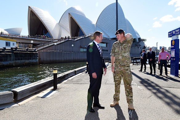 Prince Harry speaks with Premier of New South Wales Mike Baird