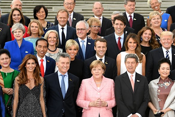 Leaders of the G20 nations and their partners pose for a family photo at 'Elbphilharmonie' during the G20 summit in Hamburg.