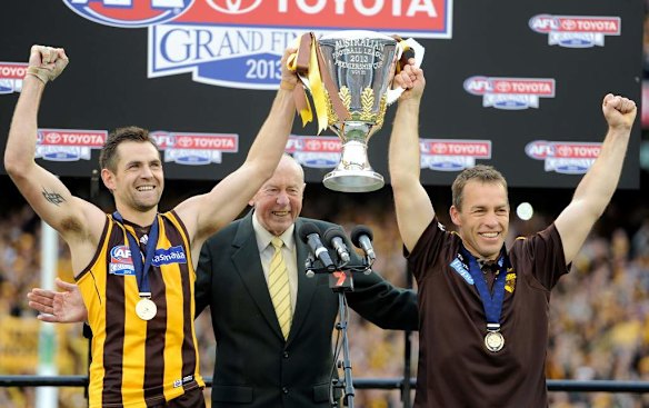 Hawthorn's Luke Hodge, John Kennedy and Alastair Clarkson with the premiership cup.