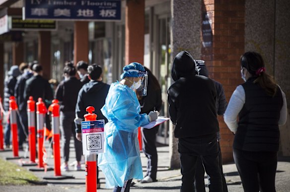 People queue down Ninth Street in Campsie to get tested at a Covid Testing Clinic. Campsie in South West Sydney is considered a COVID hotspot.