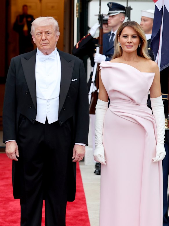 The president and the first lady pose outside the White House ahead of the dinner.