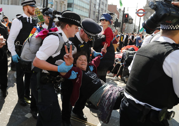 Police arrest protestors at Oxford Circus in London.