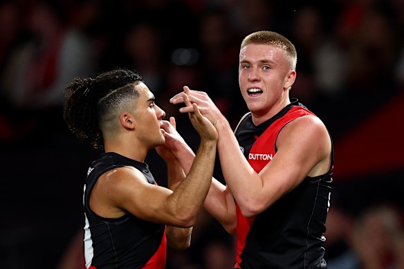 Great mates: Isaac Kako and Nate Caddy celebrate a Bombers’ goal.