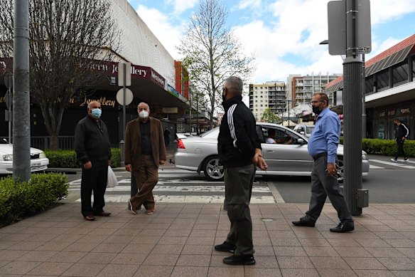 Men greet each other on the street before moving on in Fairfield during the COVID-19 lockdown. Fairfield mayor Frank Carbone said he was hopeful there was a positive way forward for his community after western Sydney mayors met with Premier Gladys Berejiklian this week. “I am proud of Fairfield residents, we have risen to this challenge, and have come forward to be vaccinated. Our cases have reduced and stabilised and vaccination rates are higher than most other parts of Sydney,” he wrote in a message to the community.