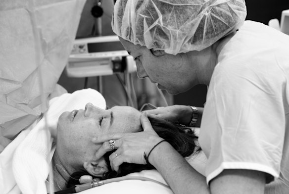 Sally Walsh is supported by her doula, Nadine Waldbaum, during her emergency caesarian at the Royal Hospital for Women in Randwick, Sydney. 
