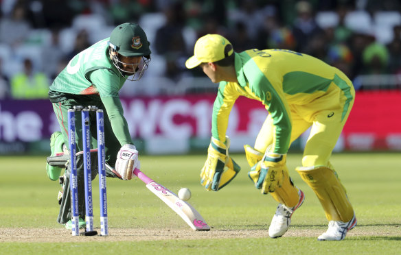 Bangladesh's Mushfiqur Rahim runs to make it to the crease to avoid a run-out.