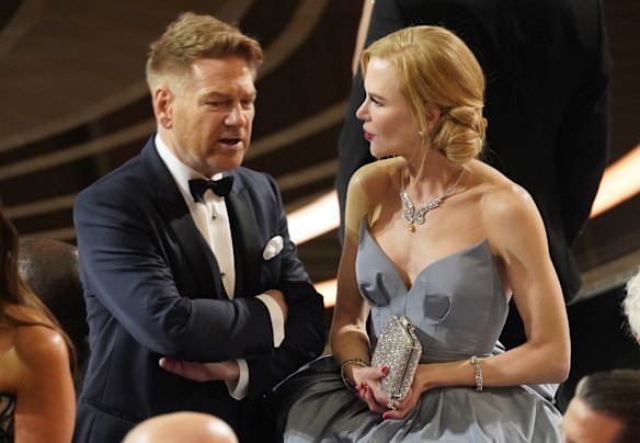 Kenneth Branagh and Nicole Kidman chat in the audience.