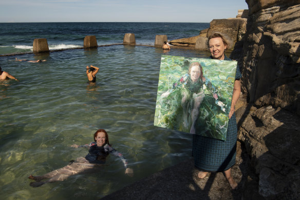 Artist Alex Snellgrove with her painting, “In her element: portrait of Helen Pitt” (in pool), a finalist in the 2021 Portia Geach Memorial Award.