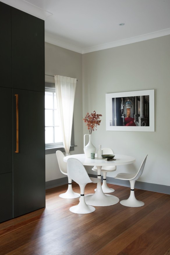 A table and chairs set bought on Ebay feature in the kitchen’s breakfast area. The artwork is a photograph by Felix Forest.