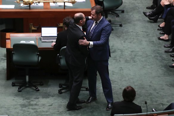 Minister for Environment and Energy Josh Frydenberg embraces Labor MP Ed Husic.