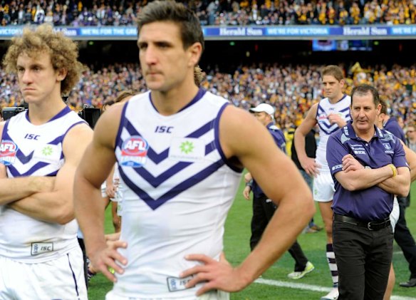 Fremantle's Chris Mayne, Matthew Pavlich and coach Ross Lyon after the loss.